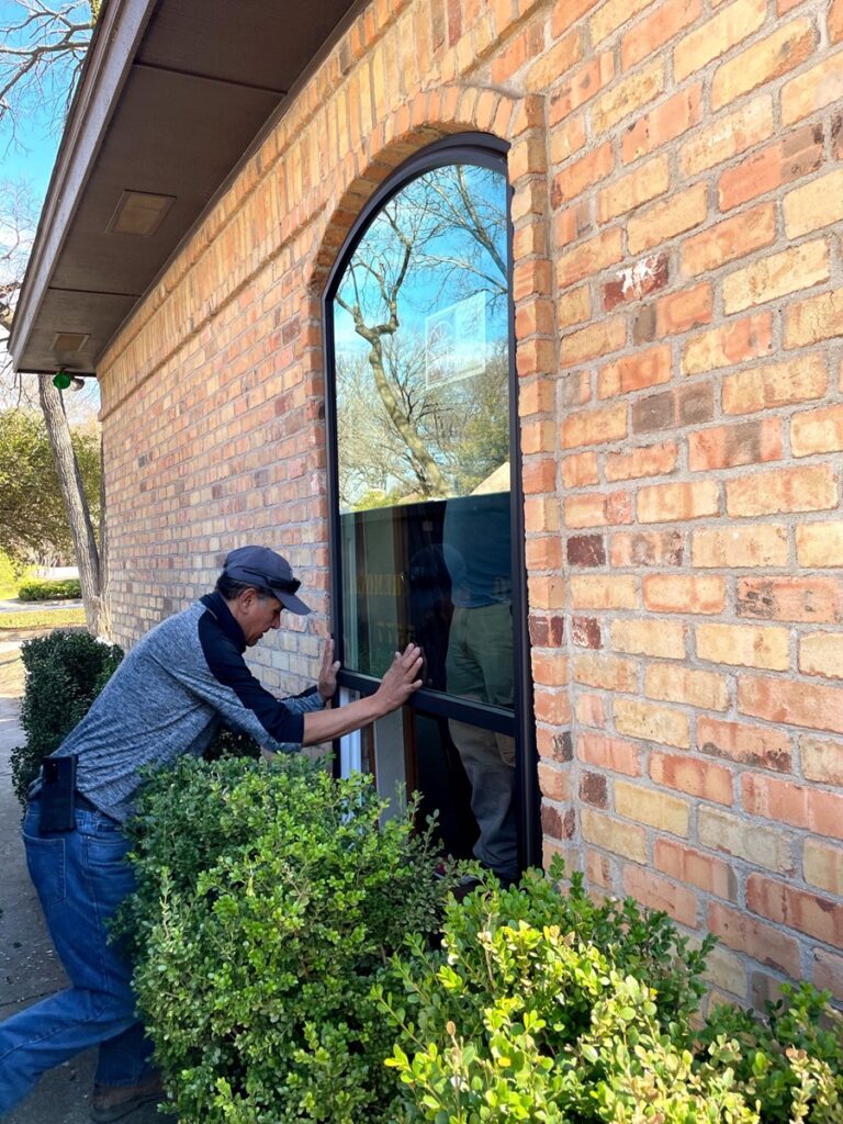 A-man-installing-energy-efficient-replacement-windows